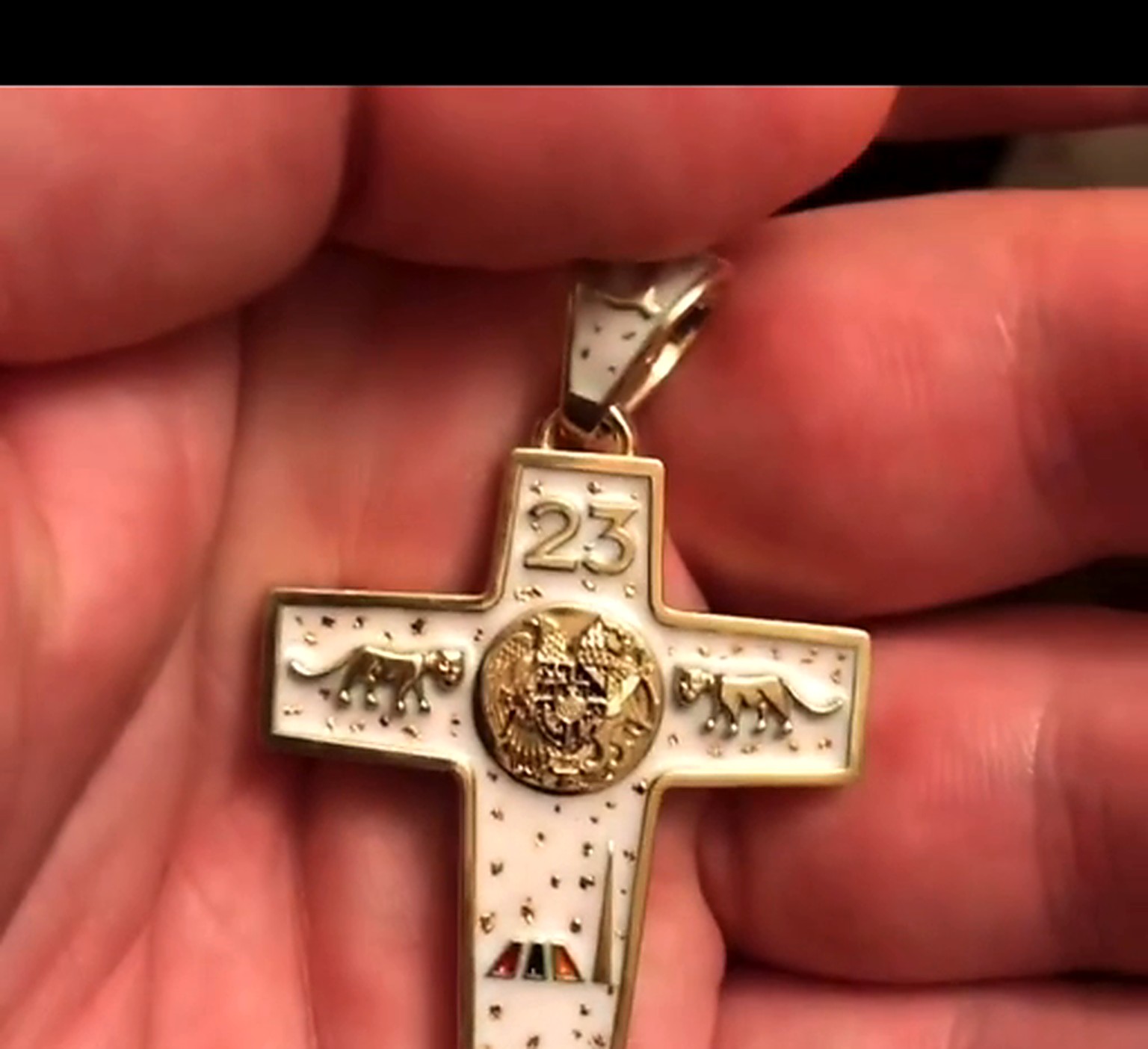 White Armenian face of cross in hand