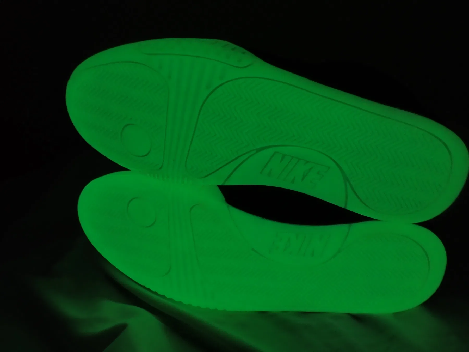 Glow in the dark Nike Yeezy 2 outsole photographed in darkness
